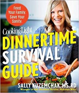 Dietitian Speaker and Author Sally Kuzemchak smiles from the cover of Cooking Light's Dinnertime Survival Guide