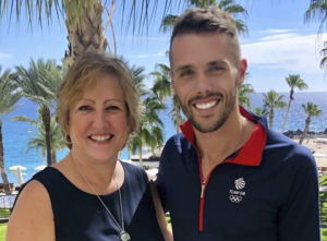 Dietitian Speaker Paula Quatromoni stands with co-presenter David Proctor before speaking about their experience together with eating disorder nutrition counseling at a professional conference.